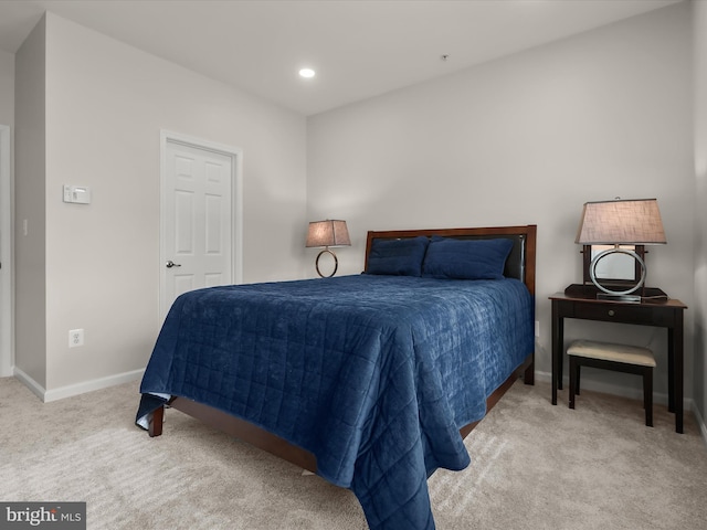 bedroom featuring light carpet