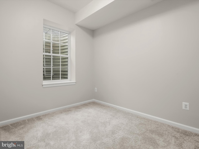 unfurnished room featuring carpet