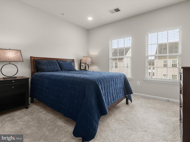 bedroom featuring light carpet