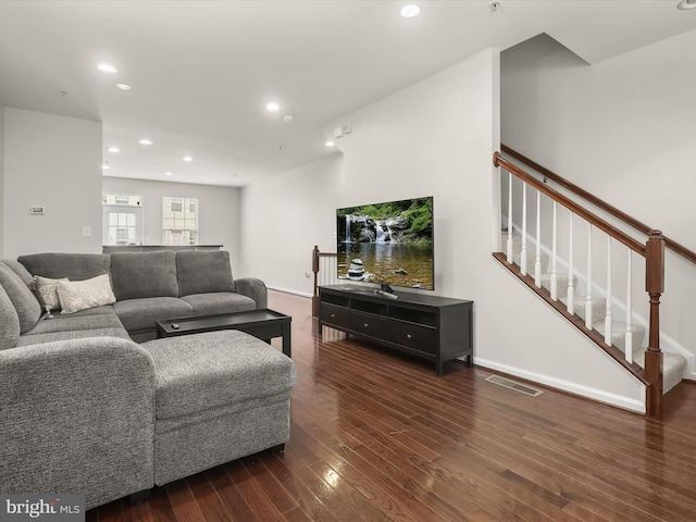 living room featuring dark wood-type flooring