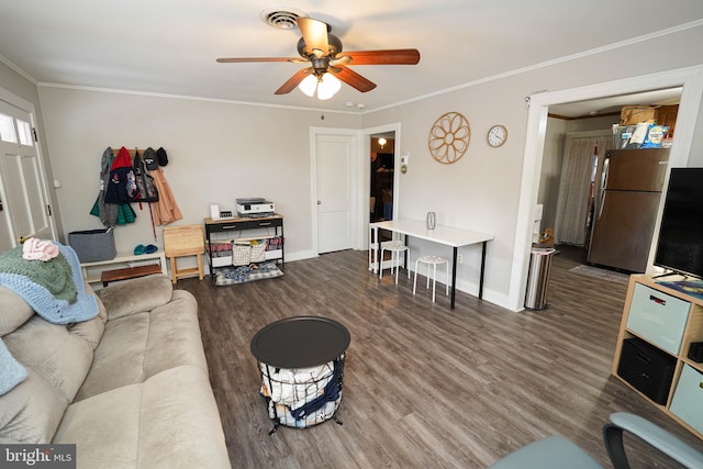 living room with hardwood / wood-style flooring, ornamental molding, and ceiling fan