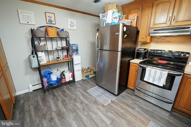 kitchen featuring hardwood / wood-style flooring, a baseboard radiator, stainless steel appliances, and crown molding