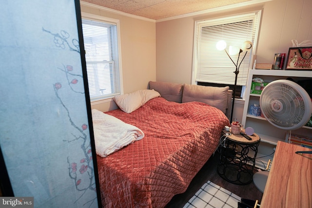 bedroom with ornamental molding