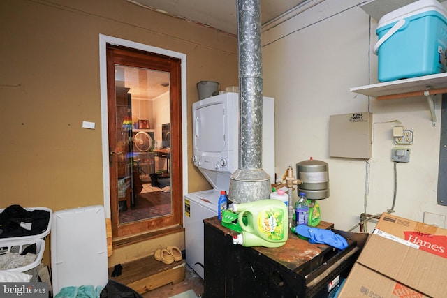 laundry room featuring stacked washing maching and dryer