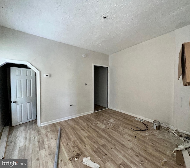 unfurnished room featuring wood-type flooring