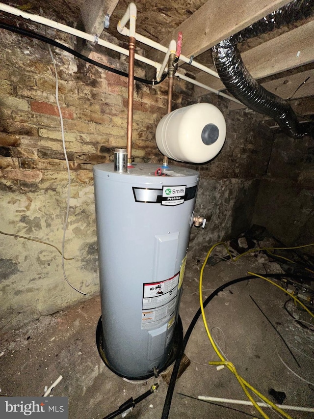 utility room with electric water heater