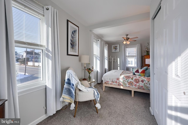 carpeted bedroom with ceiling fan