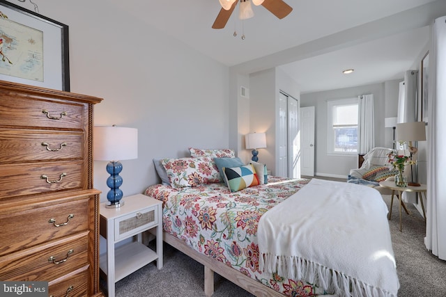 carpeted bedroom with ceiling fan and a closet