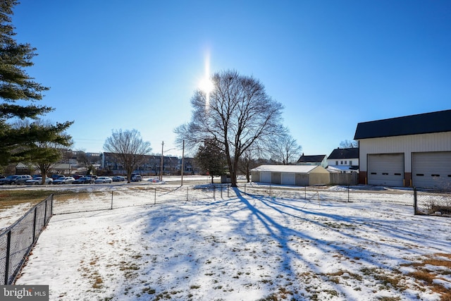 view of yard layered in snow