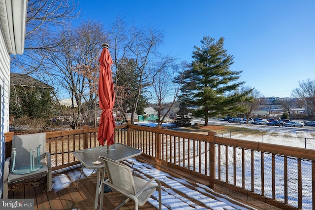 view of snow covered deck