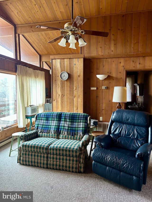 carpeted living room featuring ceiling fan, vaulted ceiling with beams, wooden walls, and wooden ceiling