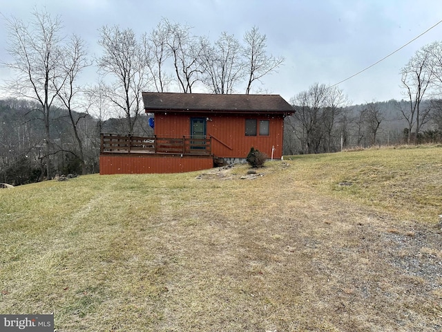 exterior space featuring a deck and a yard