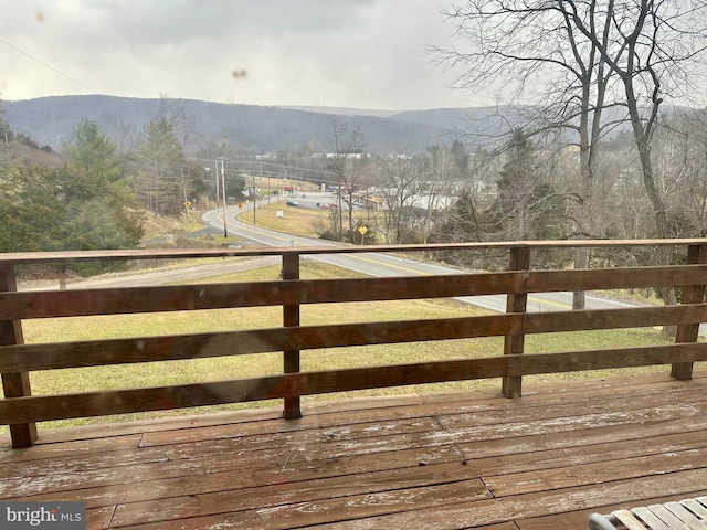 wooden terrace featuring a mountain view