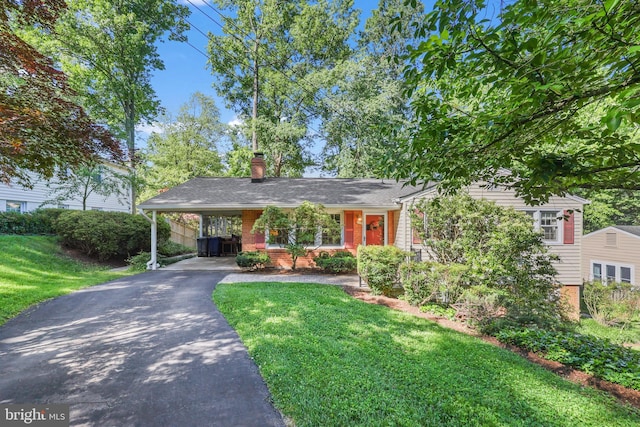1113 Cameron Rd, Alexandria, VA 22308 - view of front of home featuring driveway, a front yard, a carport, a chimney, and brick siding