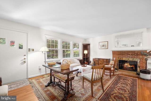 1113 Cameron Rd, Alexandria, VA 22308 - living area featuring a brick fireplace and wood finished floors