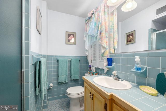 1113 Cameron Rd, Alexandria, VA 22308 - full bath featuring a shower stall, vanity, toilet, tile patterned floors, and wainscoting