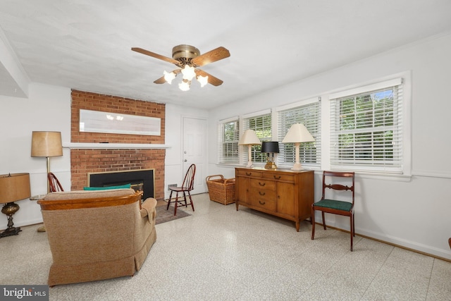 1113 Cameron Rd, Alexandria, VA 22308 - living area featuring a ceiling fan, a brick fireplace, and baseboards