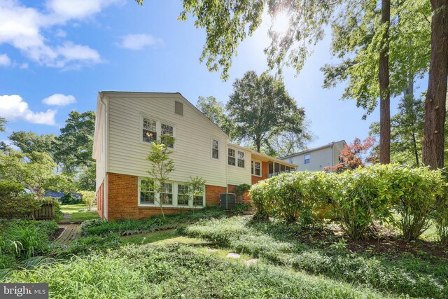 1113 Cameron Rd, Alexandria, VA 22308 - rear view of property featuring central AC unit and brick siding
