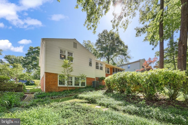 1113 Cameron Rd, Alexandria, VA 22308 - rear view of house featuring central air condition unit and brick siding