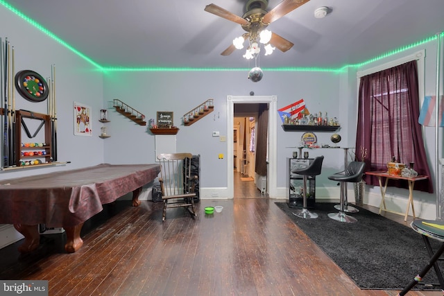 recreation room featuring ceiling fan, pool table, and dark hardwood / wood-style flooring