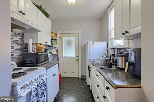 kitchen featuring white range with electric stovetop, white cabinetry, and backsplash