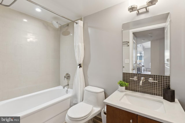 full bathroom featuring toilet, shower / tub combo, tasteful backsplash, and vanity