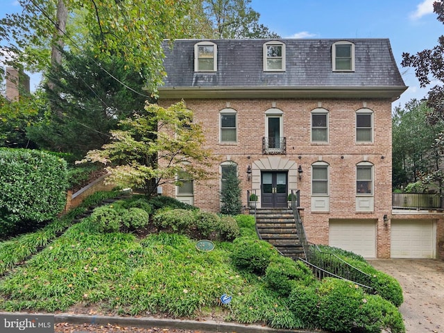 view of front of property with french doors and a garage