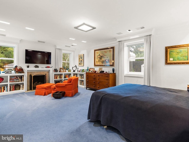 carpeted bedroom with crown molding