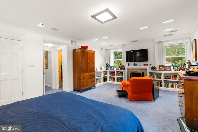 carpeted bedroom with crown molding