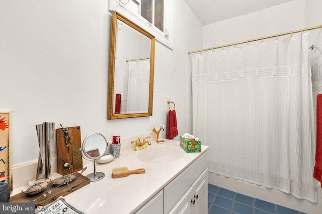 bathroom with vanity, tile patterned flooring, and shower / tub combo with curtain