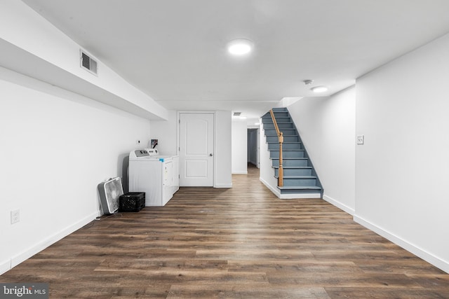 basement featuring dark hardwood / wood-style flooring and independent washer and dryer