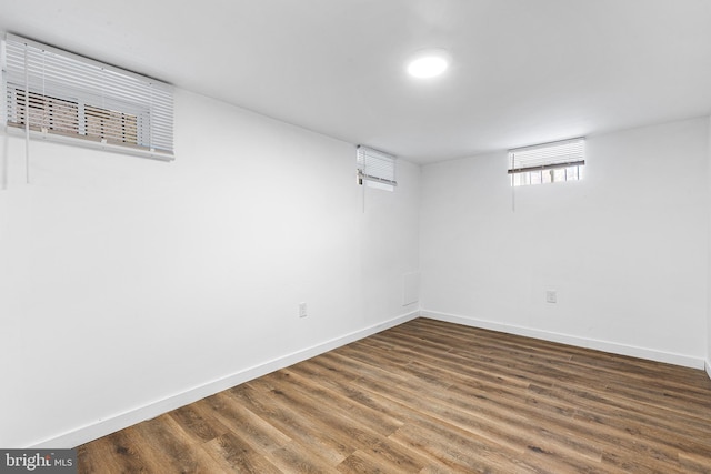 basement featuring dark hardwood / wood-style floors