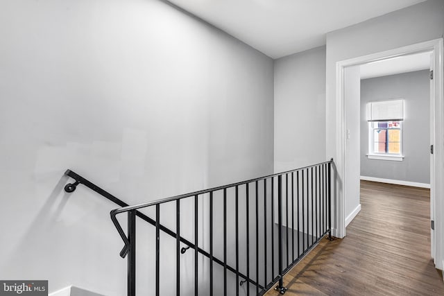 hall with dark hardwood / wood-style flooring