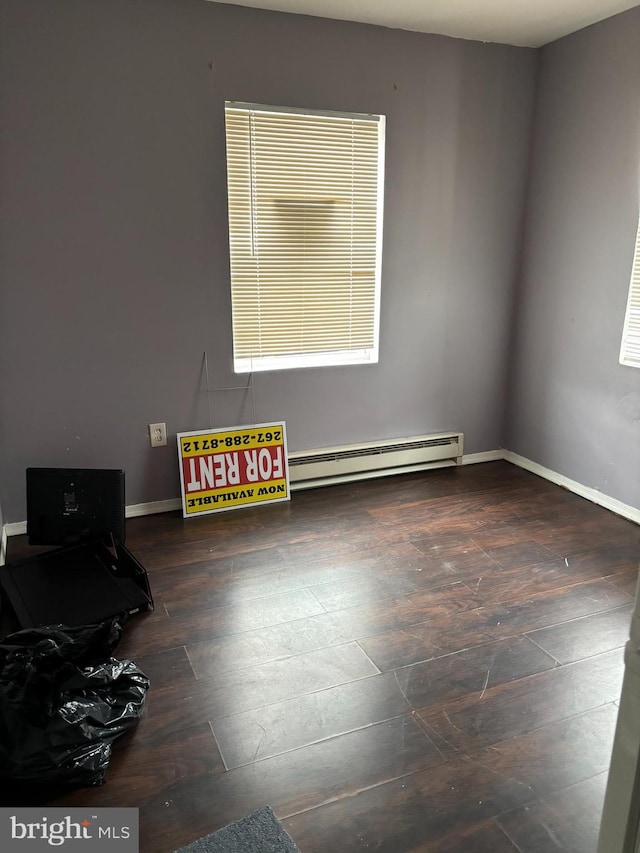 spare room with a baseboard heating unit