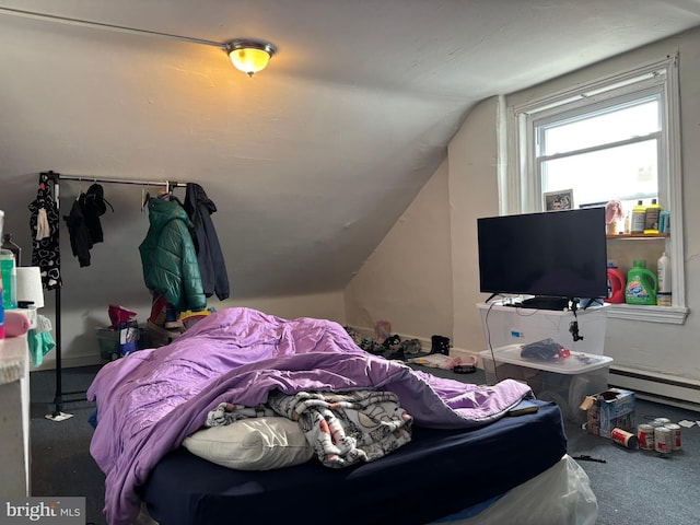 bedroom with vaulted ceiling, a baseboard radiator, and carpet flooring