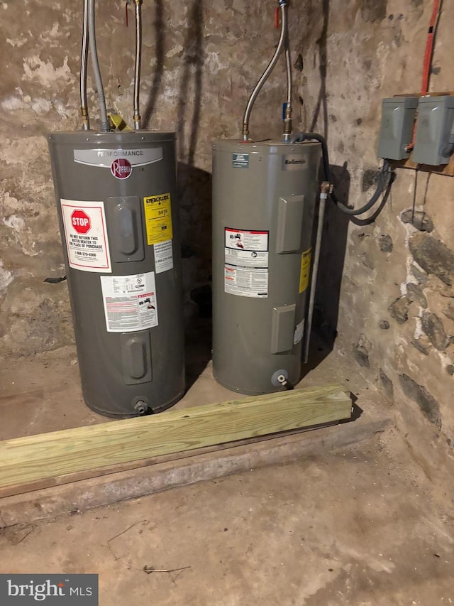 utility room featuring water heater