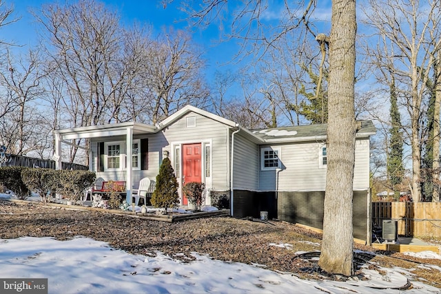 view of front of property with covered porch and cooling unit