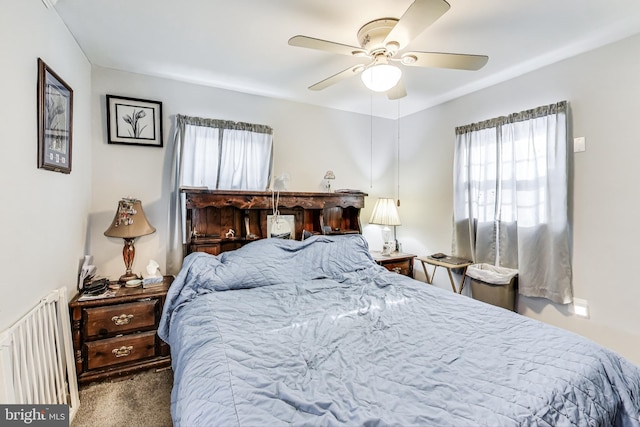 bedroom with ceiling fan and carpet