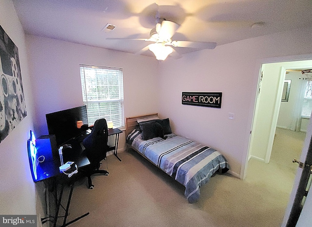 carpeted bedroom with ceiling fan