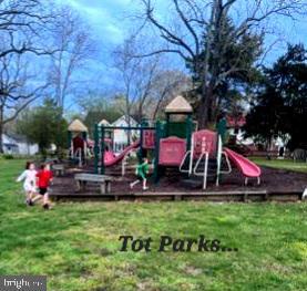 view of jungle gym with a lawn