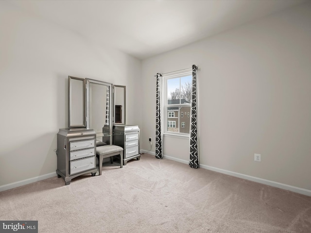 bedroom with light colored carpet