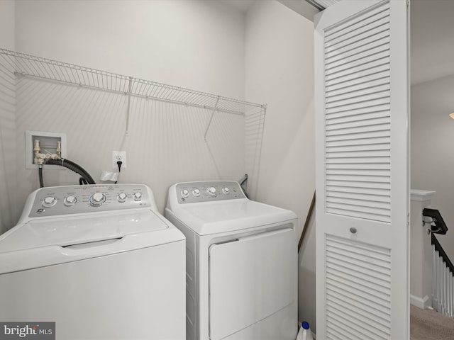 laundry area with separate washer and dryer