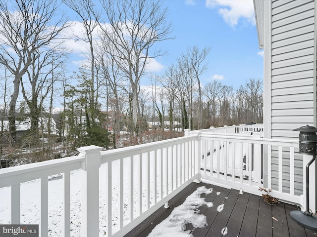 view of snow covered deck