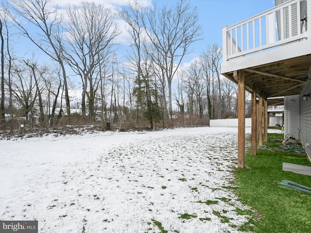 view of yard layered in snow