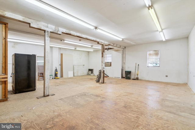 basement with stainless steel refrigerator