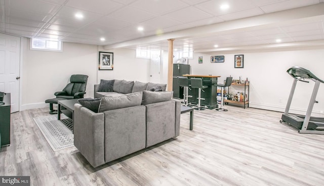 living room featuring indoor bar and hardwood / wood-style floors