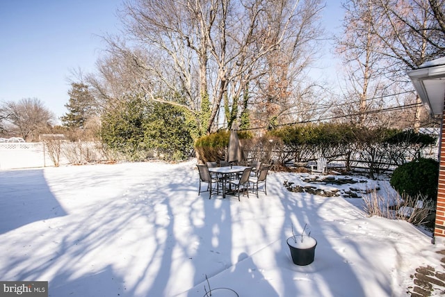 view of yard covered in snow