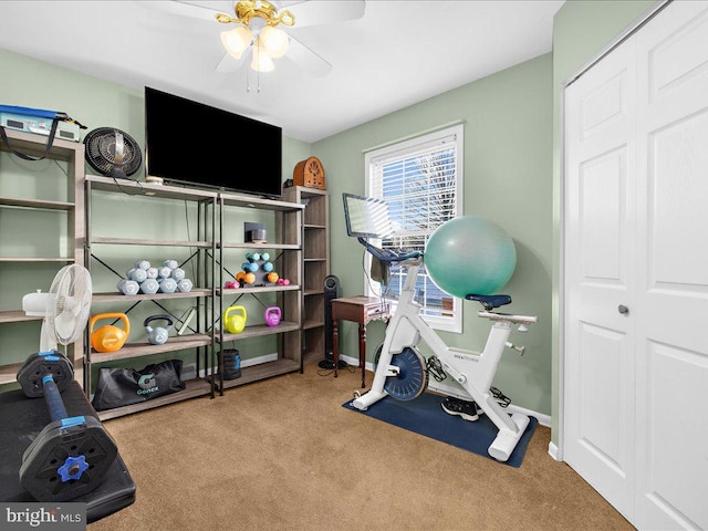 workout area with light carpet and ceiling fan