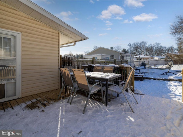 view of snow covered patio