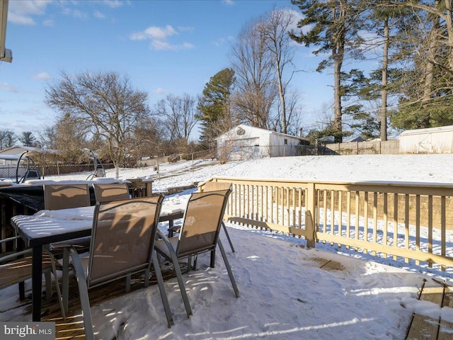 view of snow covered deck